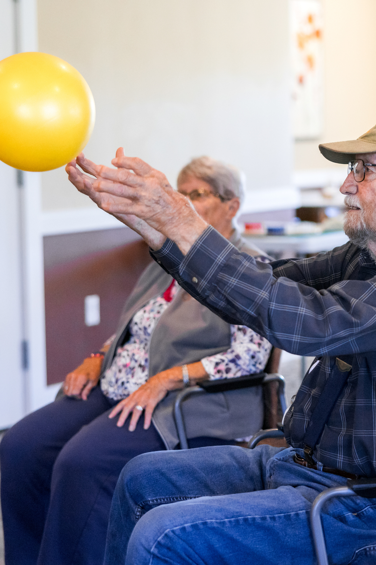 older man tossing ball portrait